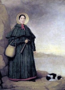 Porträt von Mary Anning mit ihrem Hund Tray und dem Golden Cap im Hintergrund.