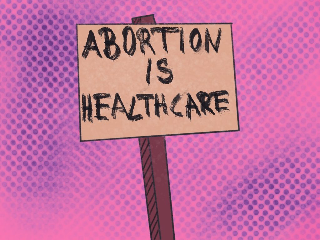 Ein Transparent, auf dem steht: Abortion is Healthcare, vor einem rosa Hintergrund